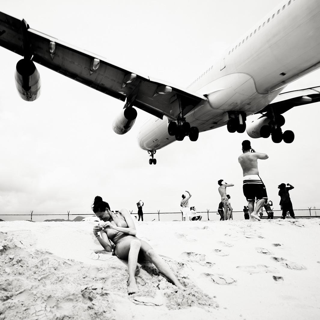 Josef and Jakob Hoflehner photograph low-flying airplanes at Maho Beach in their series, “Jet Airliner.”
