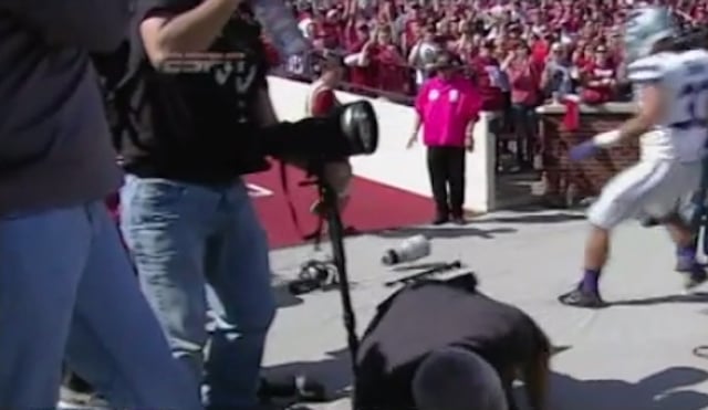 Video: Football Player Falls On and Snaps Canon Telephoto Lens in Half on the Sideline