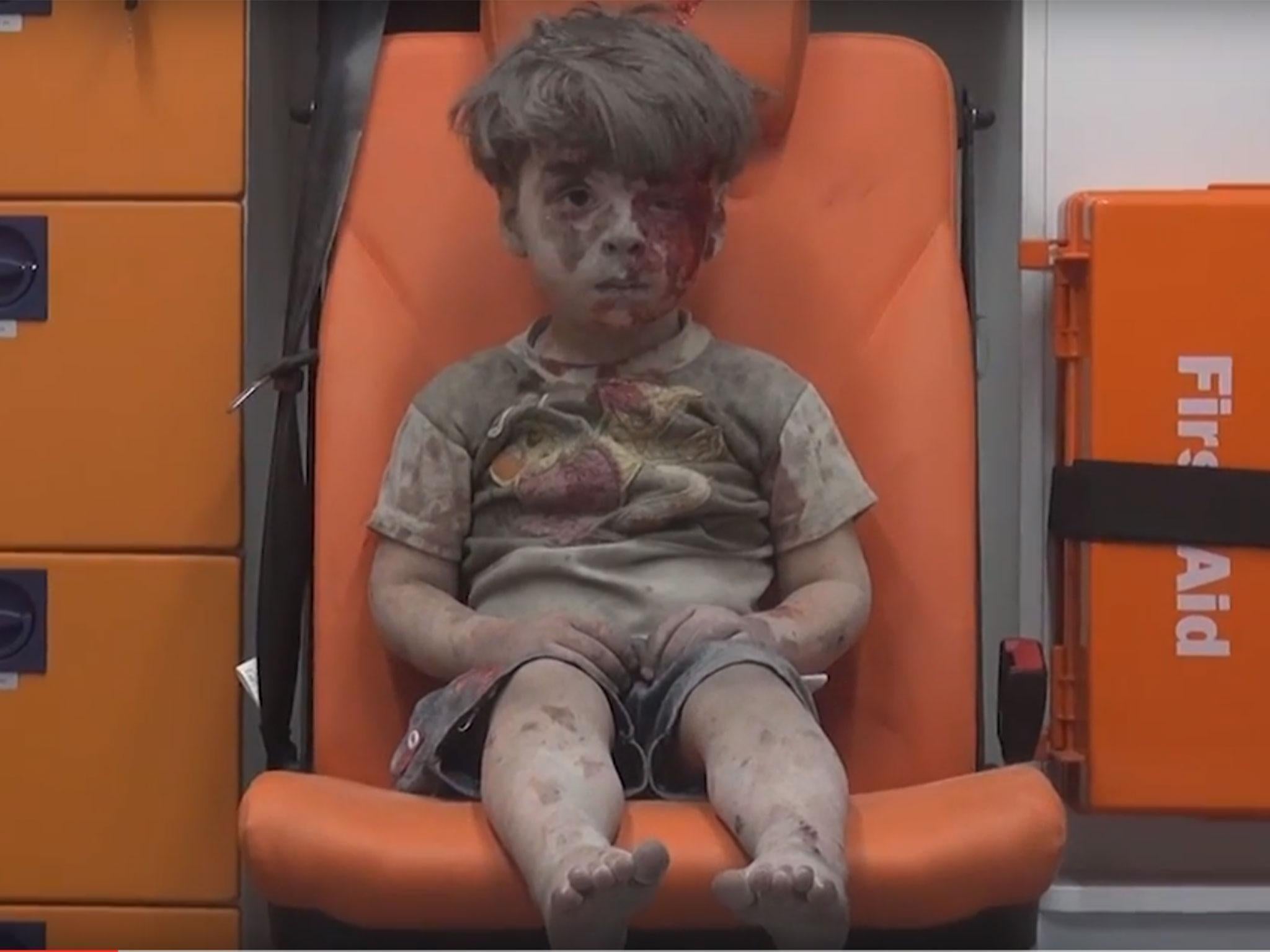 Aleppo boy: Photographer behind iconic image of dazed and bloodied child describes harrowing moments that led up to it